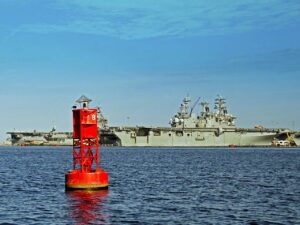 Red buoy and battleships