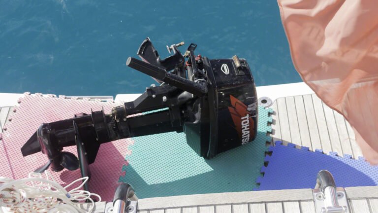 Tohatsu outboard being stowed for passage