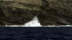 Waves crashing against the cliffs