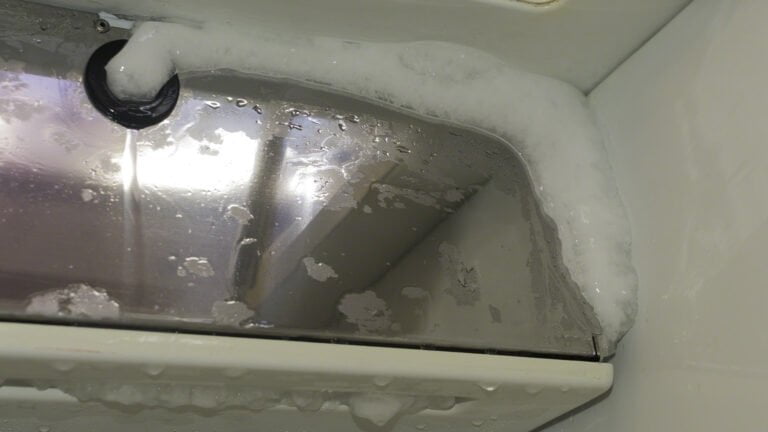 After over a month of opening the fridge in humid conditions, the evaporator plates have a very large amount of ice on them, rendering them energy-inefficient and it was time to defrost. The fridge contents were placed in thermal bags while I tried to get the process of melting ice to go quickly