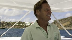 Mark navigating the Heineken Committee boat catamaran through the narrow channel at Oyster Pond