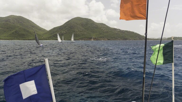The Green/Green class flag, the attention and the orange start line flag