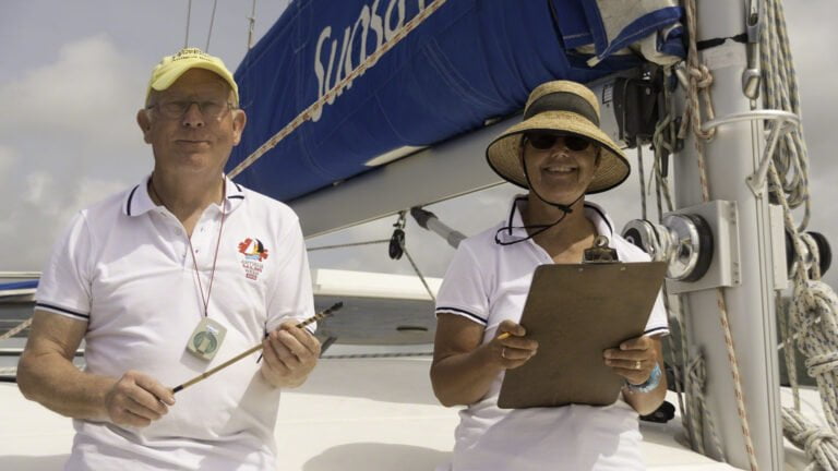 Stephen with his high-tech wind measuring stick and Irene with the clipboard are checking the conditions prior to setting the day's race course