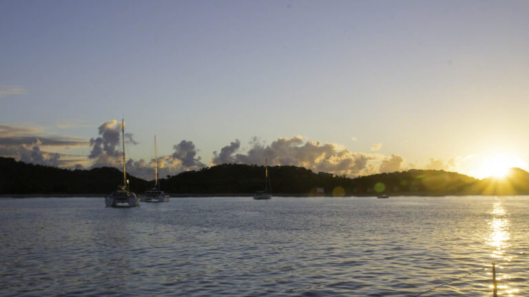 While the waters look calm, there's a long swell coming into the bay which is rocking the boats on my side of the anchorage