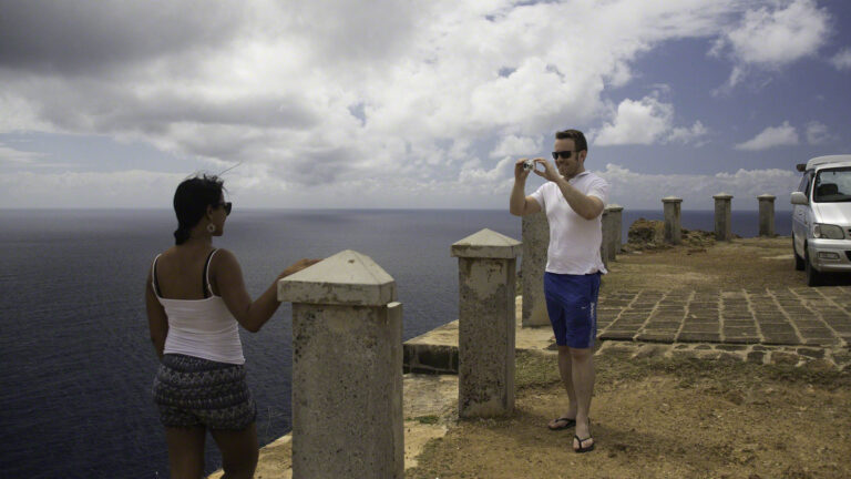 Shaun catching a photo of Wanita atop the fortifications at Shirley Heights