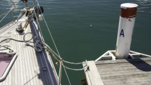 I departed the docks unassisted so I removed the fore- and aft spring lines and singled up the bow and stern lines so I could slip them off from the boat