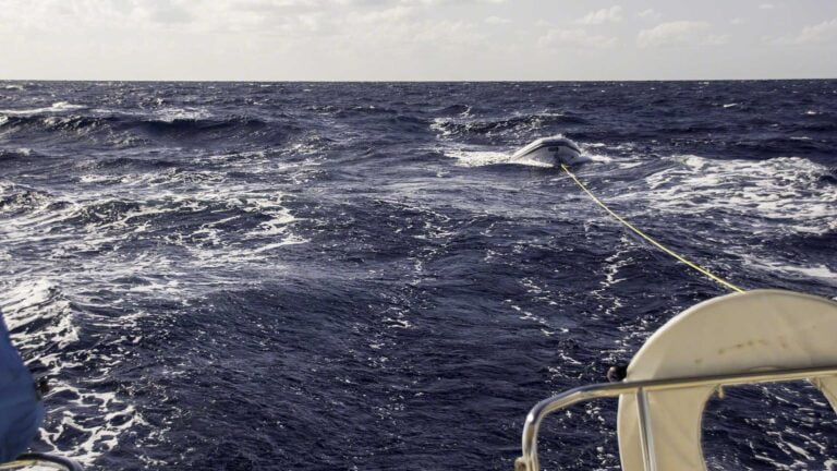 The yellow line is 80 feet or so long and allows me to tow the dinghy, outboard removed, in most sea conditions