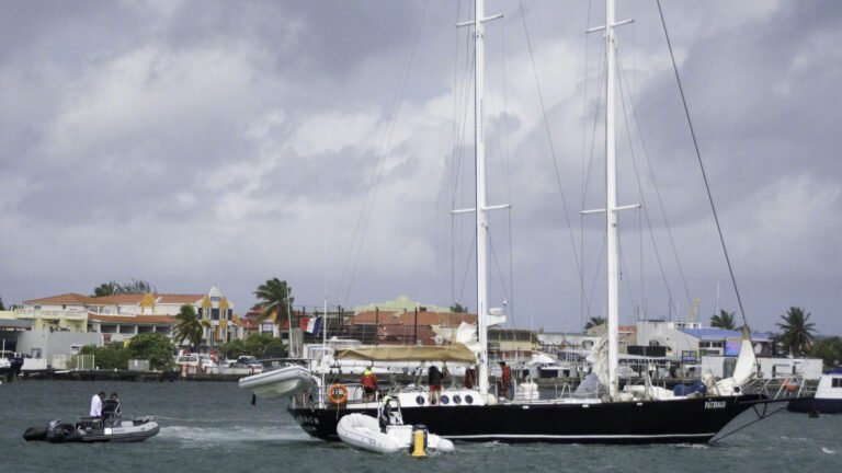 The skipper of this big heavy boat ran aground hard (evidently she hadn't looked at the chart or depth sound) and it took 3 tenders an hour to pull her off. Then they had various attempts at anchoring, including one next to me, which weren't working as the boat was in the middle of the channel. I saw them put out fenders so perhaps they opted to go to a dock