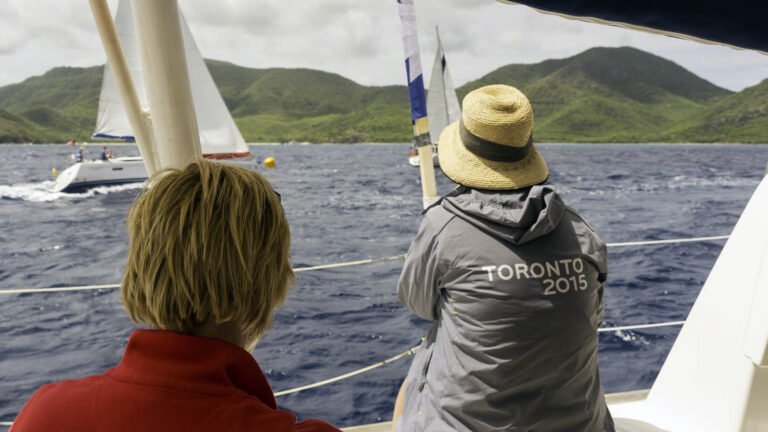 Linda about to finish a competitor crossing the line between her and the yellow marker towards shore