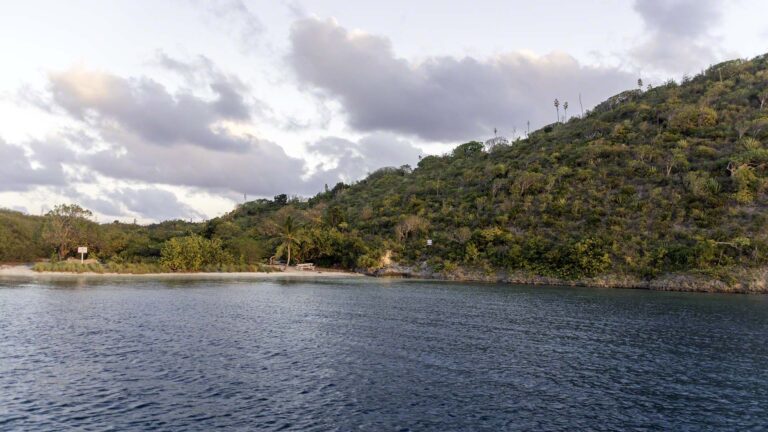 Single bench on an empty beach