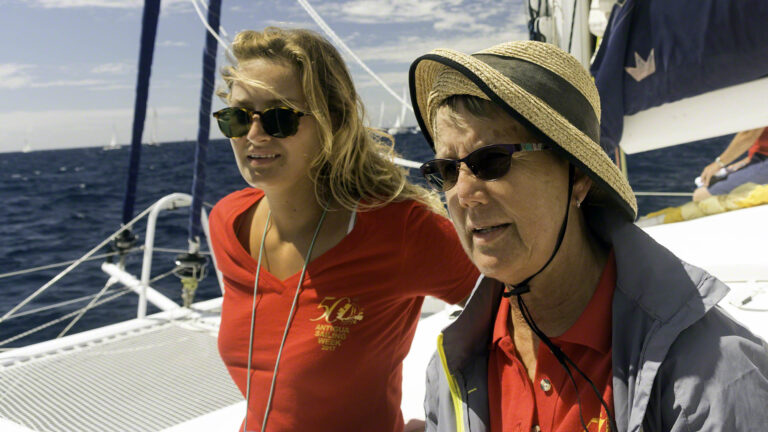 Checking to make sure that nobody goes across before the signal, Irene assisted by Daphne pay close attention
