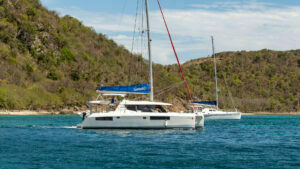 Catamaran with the "French Flag" flying (fenders out when not at a dock)