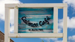 New Calmos Cafe sign, settled conditions in Grand Case