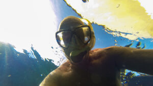 Arnd swimming on the hull